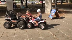 Дети и машина. Дети катаются на электромобиле. Children and car.