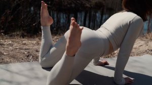 STRETCHING IN NATURE - EVELINA STRETCHES ON THE LAKE SHORE