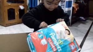 Unboxing of Pampers by cute baby