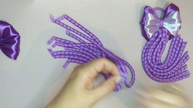 Бантики из атласной и репсовой ленты.
