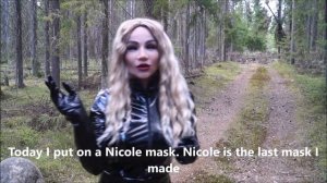 Natalia in the forest in Nicole’s new female silicone mask, leather dress and thigh high boots