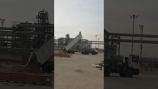 Trailer Dump Truck unloading a soil...