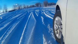 Subaru Outback on snow with stock Bridgestone Dueler H/P Sport AS Tires
