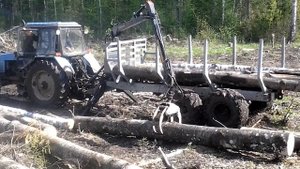 Самодельный приводной прицеп с манипулятором.