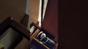 Гладильная доска на стене.