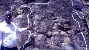 Willy korir giving view on writing on the Abosi hill stone