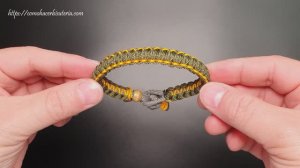 Браслет из паракорда, сочетающий толщину струн-узел кобры с застежкой с бриллиантовым узлом.