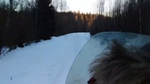 снегоход буран на повышенной и пониженной передаче по укатанному путику.