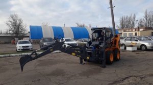 Ковшовый мини погрузчик с обратной лопатой. Обратная лопата для мини погрузчика