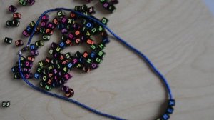 Украшение из бисера с надписью