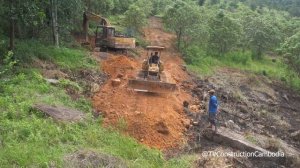 Excavator Digging And Perfectly Dozer Leveling Ground Plantation For Road Construction On Mountain