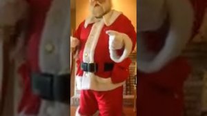 Santa in uniform gets prepared