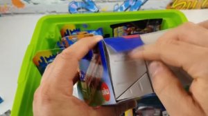 A box full of various types of small and large cars