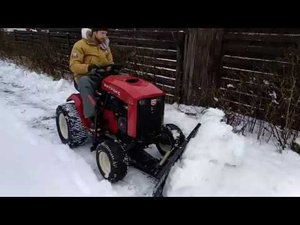 Новинка! Уборка снега. Первый российский трактор Митракс Т10 с лопатой отвал.
