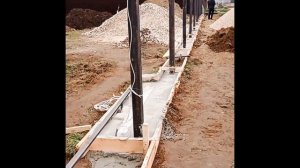 Строительство забора из евроштакетника с кирпичными столбами и откатными воротами. Евроштакетник