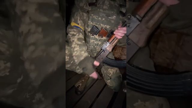 Ukrainian soldiers play carols on AK-47 assault rifles