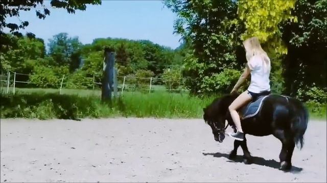 girl in shorts ride pony