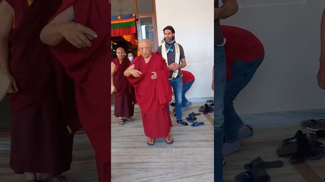 Chokyi Nyima Rinpoche giving blessings.