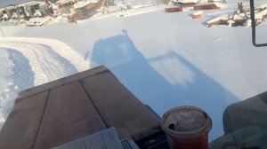 На Кировце по сугробам, с двумя прицепами.