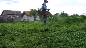 Using my Husqvarna 545 RX brushcutter in high grass with the line head on
