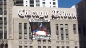 Unknown activists placed #savedonbasspeople banner on the Chicago Tribune Tower. 19.05.2015