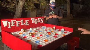 Wiffle ball toss carnival game