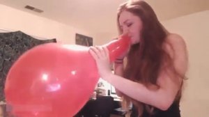 Looner Girl Blows The Red Balloon to its Maximum Capacity