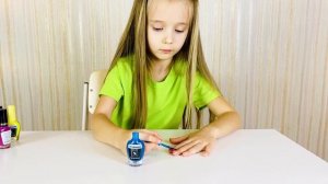 Polina paints her nails with magical colored varnishes. Children's song of color.