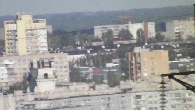 Вид на Красноармейский район города Волгограда с Ергенинской возвышенности, съемка с увеличением.