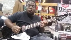 Playing a 2018 Gibson Firebird V at Sam Ash Musical instruments in Richmond, Virginia