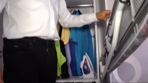 Гладильная доска в шкафу. Встроенная гладильная доска.