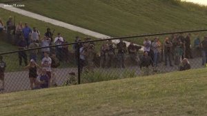 Crowd forms line in front of Confederate monument in Brandenburg, Ky.