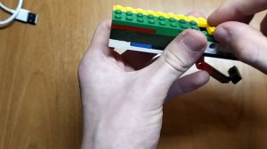 КАК СДЕЛАТЬ ПИСТОЛЕТ ИЗ ЛЕГО СТРЕЛЯЮЩИЙ РЕЗИНКАМИ ПО ОДНОМУ??????