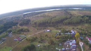 Полет над деревенькой. Озеро в дали.