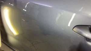 Сложный ремонт вмятины без покраски на двери автомобиля Kia Rio
