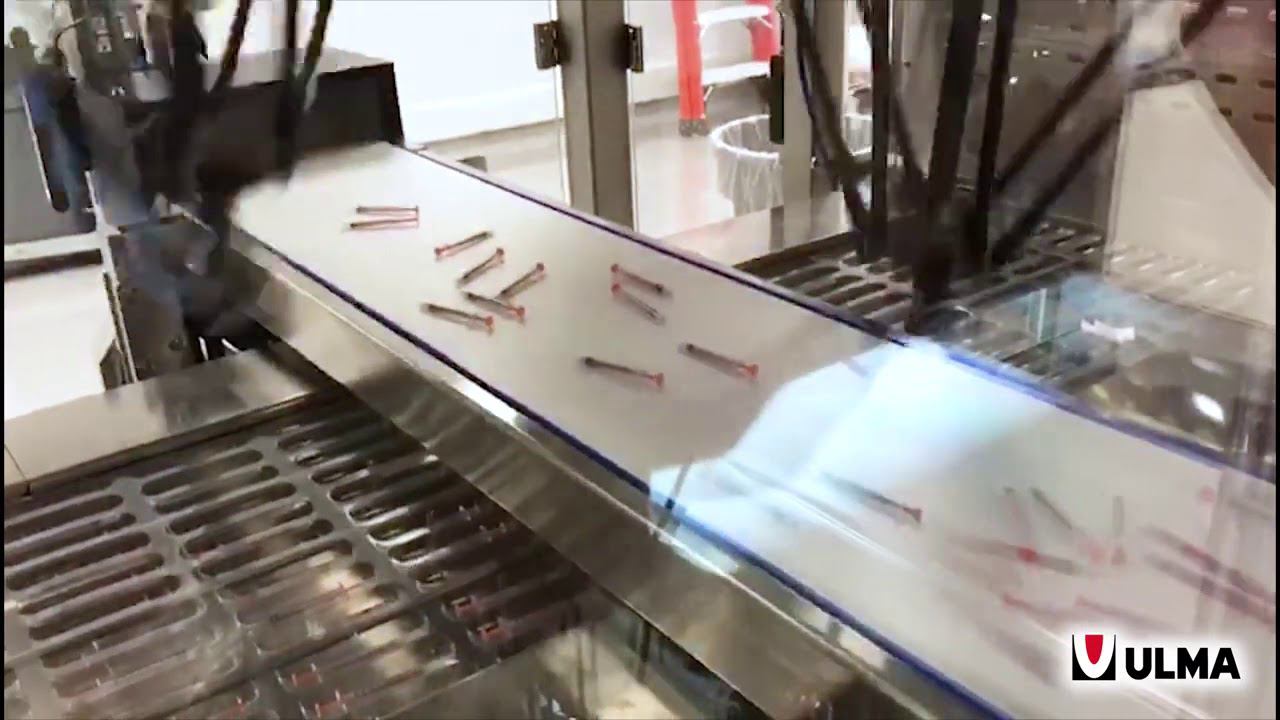 Автоматизированная роботизированная загрузка шприцов c колпачками в термоформер