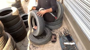 Man Repairing Old used Tire with simple Techniques