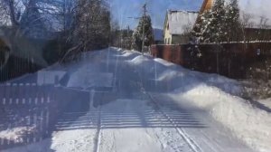 Снегоочистка автомобилем с самодельным плугом.