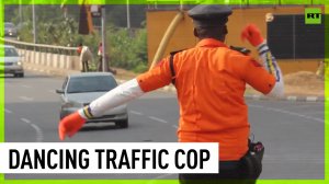 Nigerian traffic cop controls cars with dance