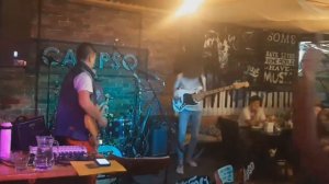 Red Guitar Pick, Live in Calipso