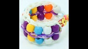 Красивые браслеты из резинок с бусинами.