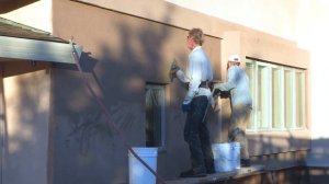 Stucco color refinishing for removing old stains