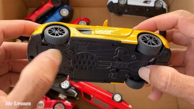 Box full of model Cars, Beetle, Lexus LM300H, Civic, SLR, Porshe911, Lamborghini, GT500.