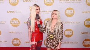 Aubrey Kate wears a skin tight red piece to the 2020 Xbiz Awards.
