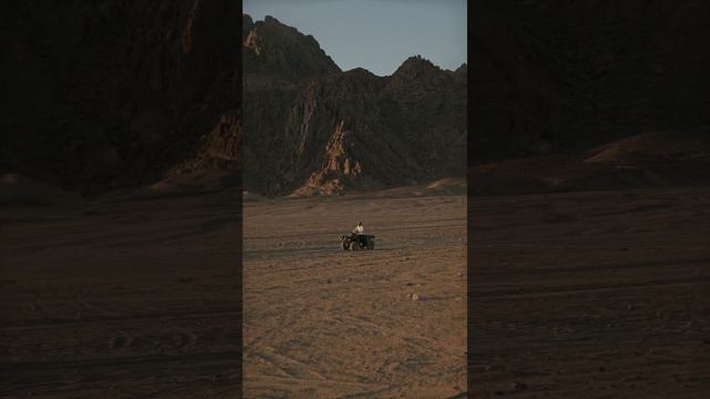 Quad Pilot Driving by at Great Distance [Short]