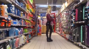 shopping in shiny leggings and wedge boots