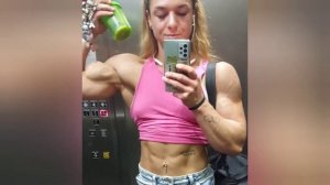 Beautiful muscular woman flexing biceps