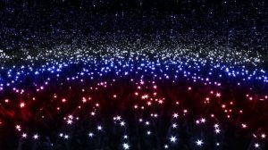 Огни на стадионе. Люди с фонариками в руках на концерте. Флешмоб. Горящие телефоны на шоу.