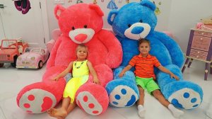 Diana and Roma play with Giant Teddy Bear