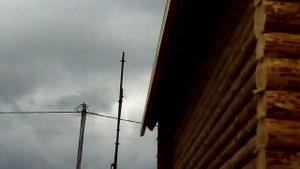 Мансардная крыша сруба с верандой